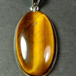 Sterling Silver pendant with a 20mm x 35mm Tiger Eye cabochon