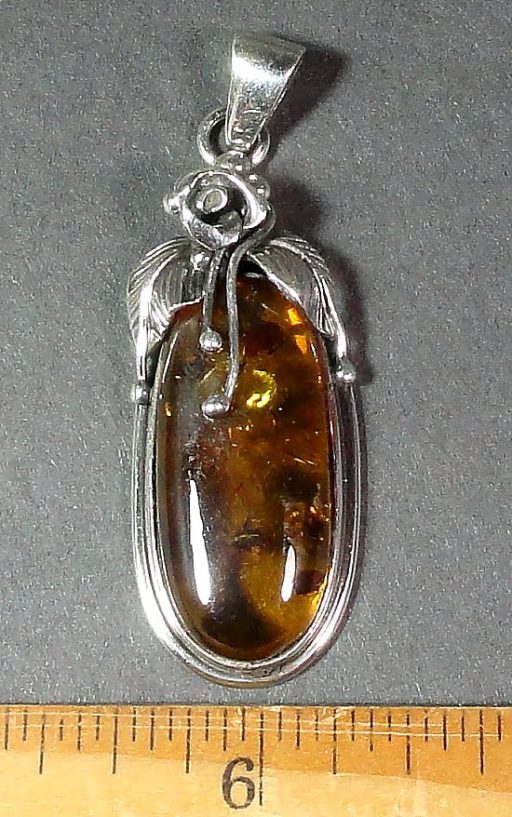 Silver detail pendant with a nice 14mm x 30mm Amber stone